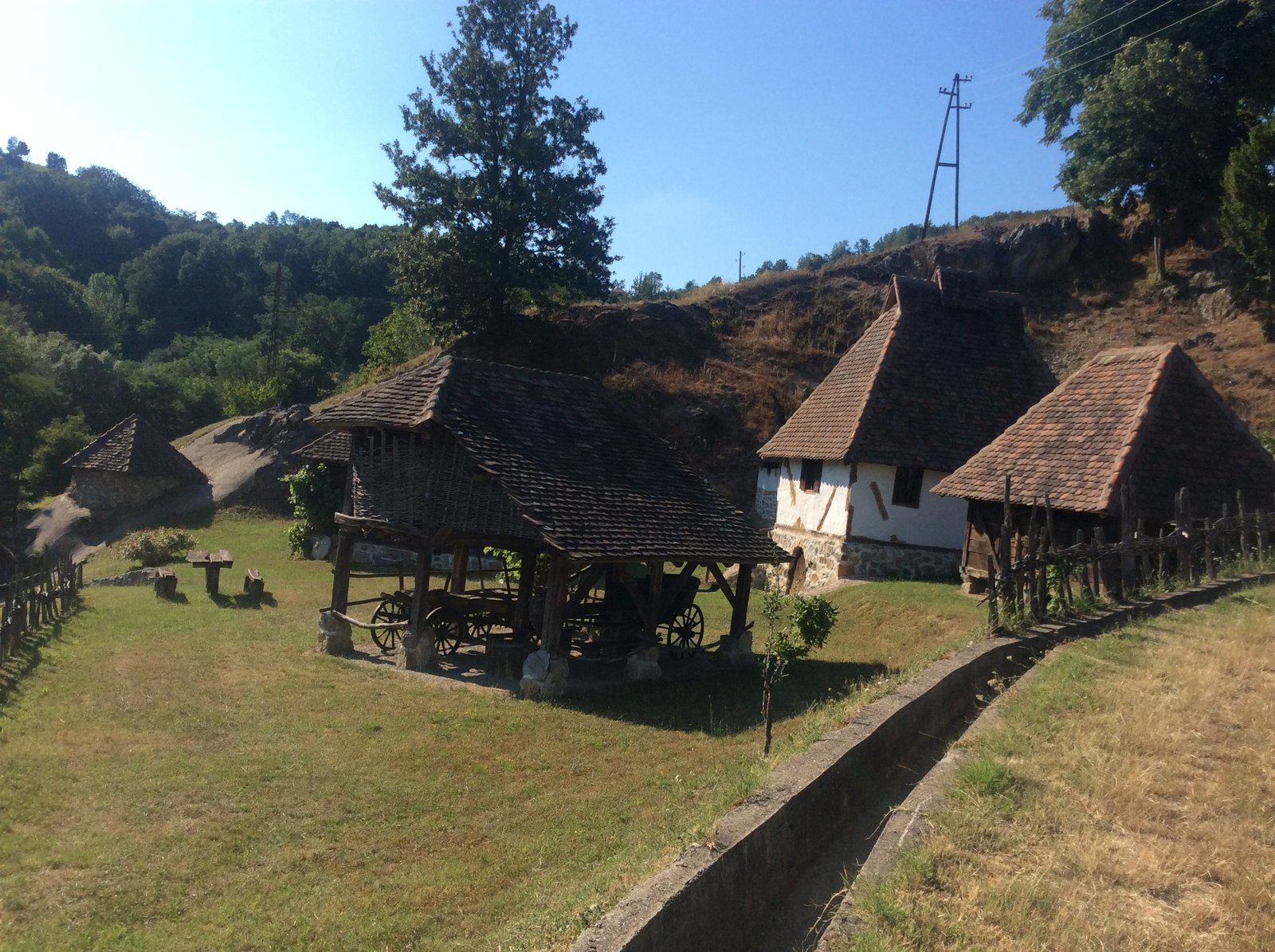 Traditional Serbian farmstead at Crkveni park Dobri Potok, wooden buildings and granary